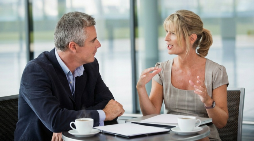 Nonprofit leader meeting with a prospective major donor to discuss philanthropic goals and build a trusted relationship.