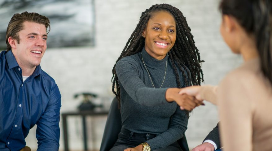 An image depicting a handshake or a group of people working together can symbolize the collaboration between donors and organizations to achieve common goals.